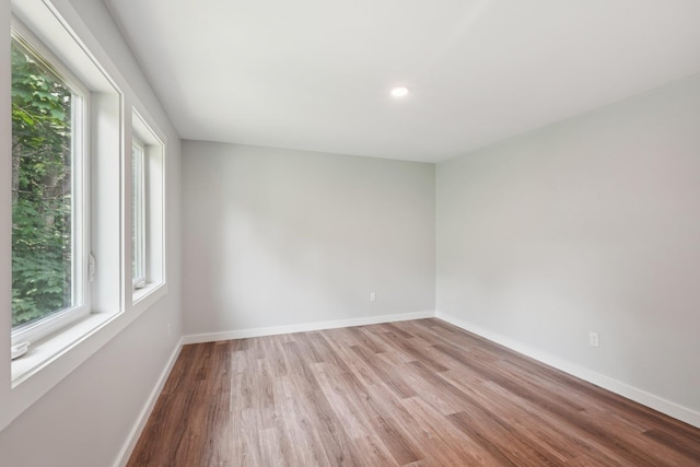 10 De Clark Pl, Nanuet, NY 10954 - empty room with wood finished floors and recessed lighting