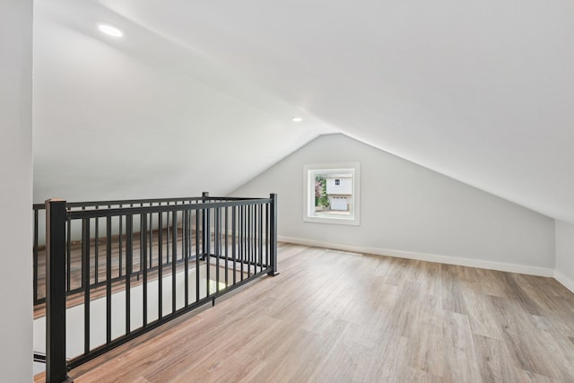 10 De Clark Pl, Nanuet, NY 10954 - bonus room with wood finished floors, vaulted ceiling, and recessed lighting