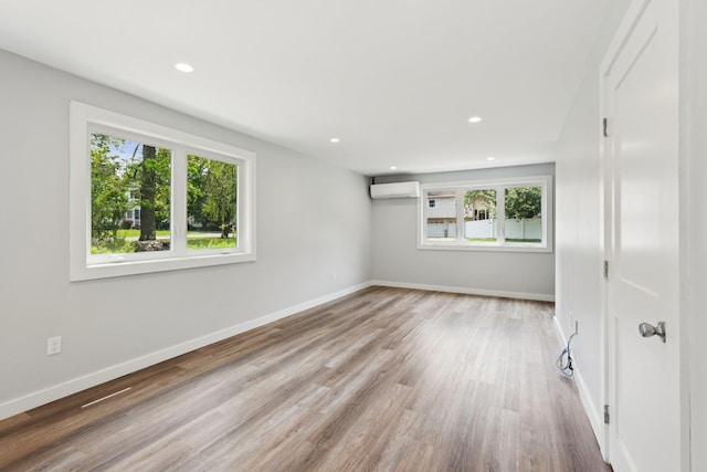 10 De Clark Pl, Nanuet, NY 10954 - spare room with a wall mounted air conditioner, wood finished floors, and recessed lighting