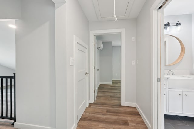 10 De Clark Pl, Nanuet, NY 10954 - hallway featuring a wall mounted AC, attic access, and dark wood-style flooring