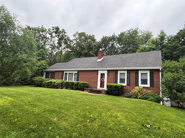 15 Orchard Rd, Poughkeepsie, NY 12603 - ranch-style house featuring brick siding, a front yard, a chimney, and a shingled roof