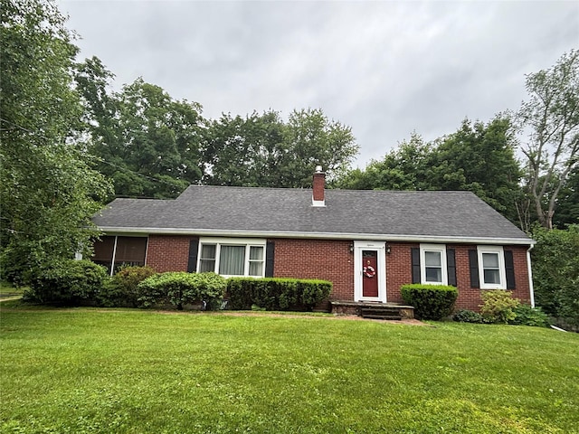 15 Orchard Rd, Poughkeepsie, NY 12603 - ranch-style home featuring brick siding, a front yard, and a chimney