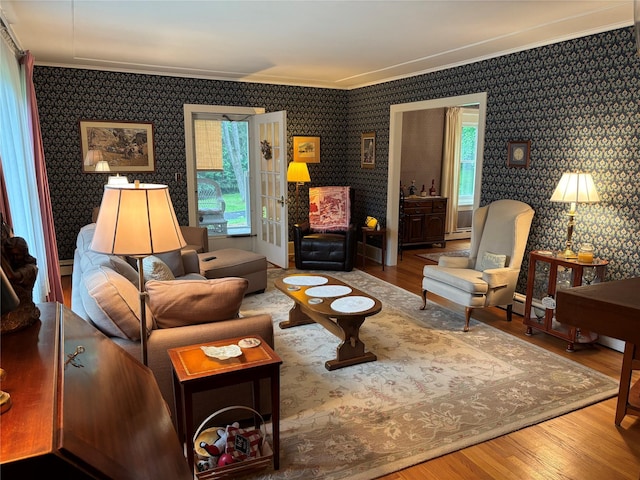 15 Orchard Rd, Poughkeepsie, NY 12603 - living area featuring crown molding, plenty of natural light, wood finished floors, and wallpapered walls