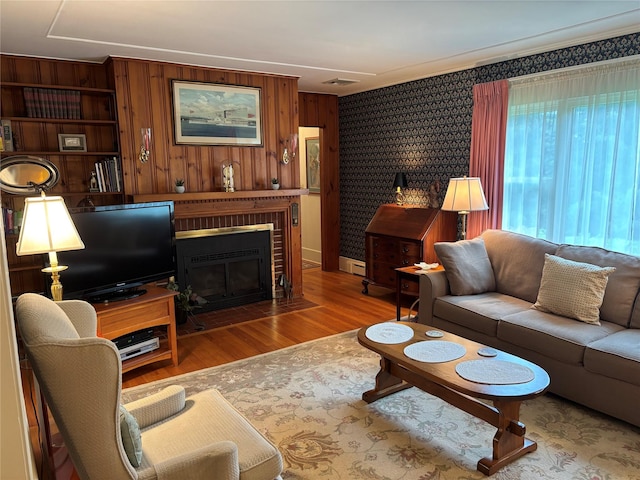 15 Orchard Rd, Poughkeepsie, NY 12603 - living area featuring wood finished floors, a fireplace, and wood walls