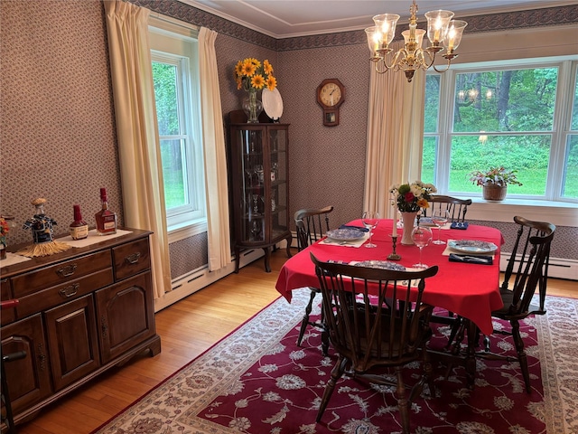 15 Orchard Rd, Poughkeepsie, NY 12603 - dining room featuring wallpapered walls, light wood-type flooring, crown molding, a chandelier, and healthy amount of natural light
