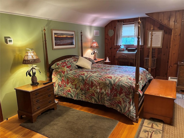 15 Orchard Rd, Poughkeepsie, NY 12603 - bedroom with wood finished floors, vaulted ceiling, and a baseboard heating unit