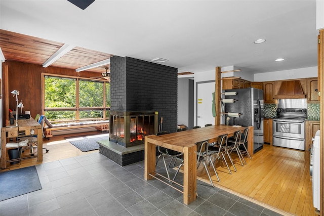 15 Relyea Ter, Wappingers Falls, NY 12590 - tiled dining room featuring a fireplace, baseboard heating, beam ceiling, and recessed lighting