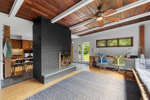 15 Relyea Ter, Wappingers Falls, NY 12590 - living room featuring wood ceiling with exposed beams, a desk, ceiling fan, a brick fireplace, and light wood-type flooring