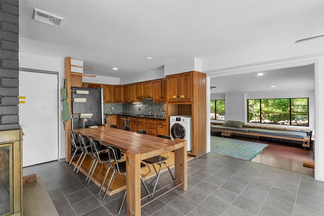 15 Relyea Ter, Wappingers Falls, NY 12590 - tiled dining space with washer / clothes dryer, a sink, and recessed lighting