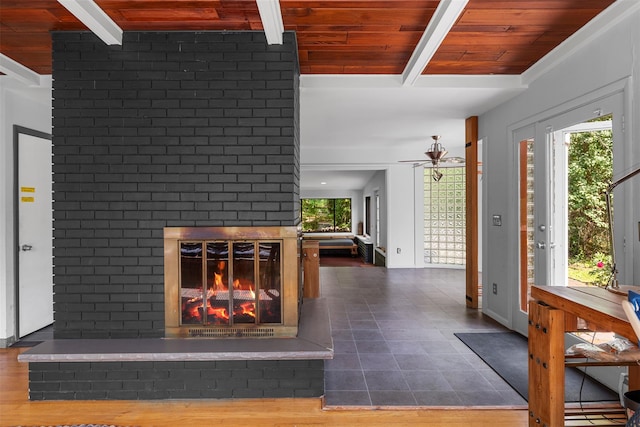 15 Relyea Ter, Wappingers Falls, NY 12590 - unfurnished living room with a fireplace, a ceiling fan, wooden ceiling with exposed beams, and tile patterned floors