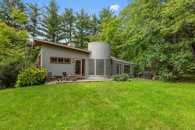 15 Relyea Ter, Wappingers Falls, NY 12590 - rear view of house with a lawn, a patio area, and a chimney