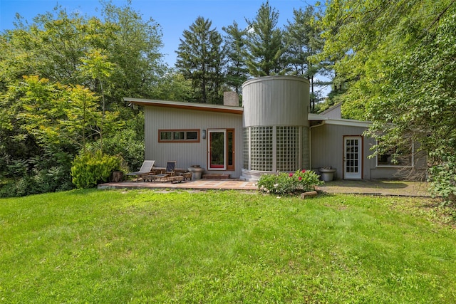 15 Relyea Ter, Wappingers Falls, NY 12590 - back of house featuring a yard, a patio, and a chimney