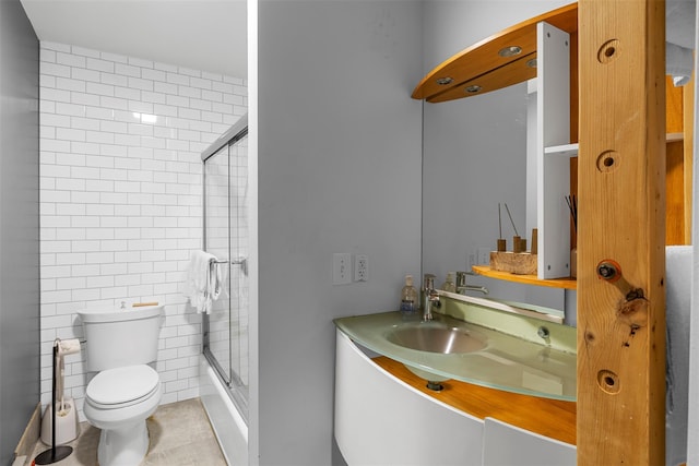 15 Relyea Ter, Wappingers Falls, NY 12590 - full bathroom featuring toilet, a stall shower, vanity, tile patterned floors, and tile walls