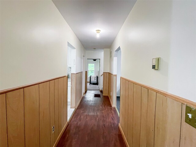 94 Highland Ave, Woodridge, NY 12789 - hallway featuring a wainscoted wall and dark wood-style flooring
