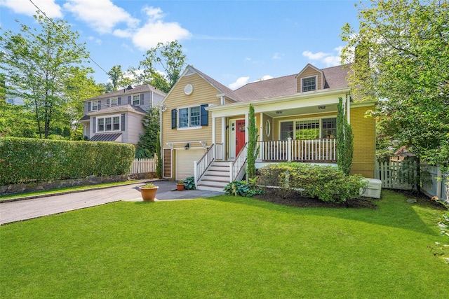 4 Senate Pl, Larchmont, NY 10538 - view of front of home with a porch, an attached garage, concrete driveway, and a chimney