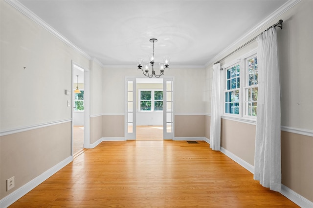 4 Senate Pl, Larchmont, NY 10538 - unfurnished dining area featuring light wood-style floors, a chandelier, and crown molding