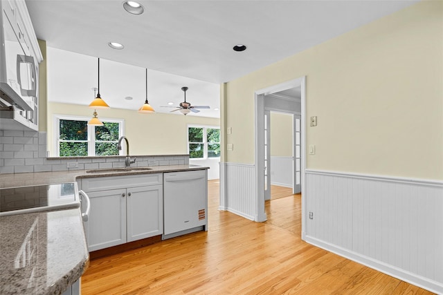 4 Senate Pl, Larchmont, NY 10538 - kitchen featuring white appliances, ceiling fan, wainscoting, a peninsula, and light wood-style flooring