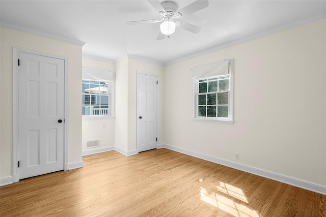 4 Senate Pl, Larchmont, NY 10538 - unfurnished bedroom with multiple windows, light wood-style flooring, ornamental molding, and ceiling fan
