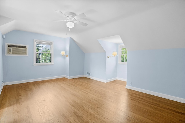 4 Senate Pl, Larchmont, NY 10538 - additional living space with a wall unit AC, lofted ceiling, wood finished floors, ceiling fan, and healthy amount of natural light