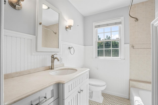 4 Senate Pl, Larchmont, NY 10538 - bathroom featuring wainscoting, vanity, tile patterned flooring, and bathtub / shower combination