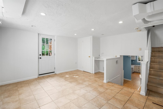 4 Senate Pl, Larchmont, NY 10538 - unfurnished room with recessed lighting, a textured ceiling, light tile patterned floors, and stairs