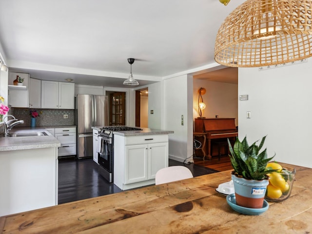5221-5223 Rte 28, Mount Tremper, NY 12457 - kitchen with a sink, stainless steel appliances, open shelves, dark wood finished floors, and white cabinetry