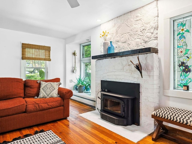 5221-5223 Rte 28, Mount Tremper, NY 12457 - living room featuring a baseboard heating unit, wood-type flooring, and plenty of natural light