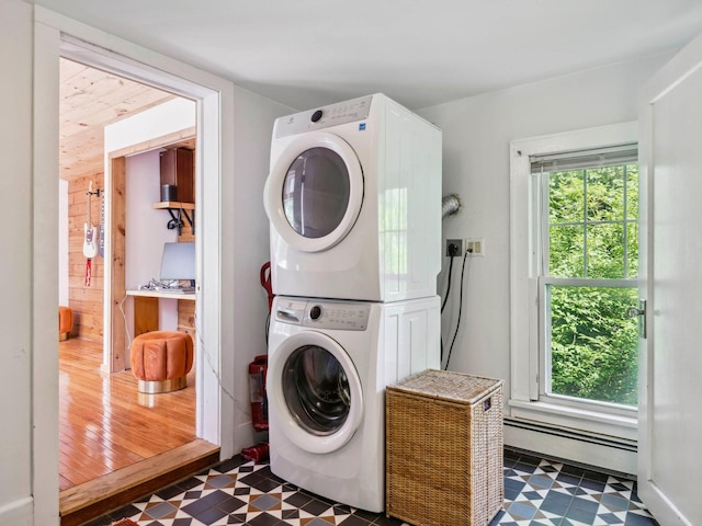 5221-5223 Rte 28, Mount Tremper, NY 12457 - laundry area with stacked washer / dryer, baseboard heating, tile patterned floors, and healthy amount of natural light