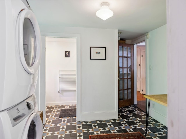 5221-5223 Rte 28, Mount Tremper, NY 12457 - washroom featuring stacked washing machine and dryer, tile patterned floors, and baseboards