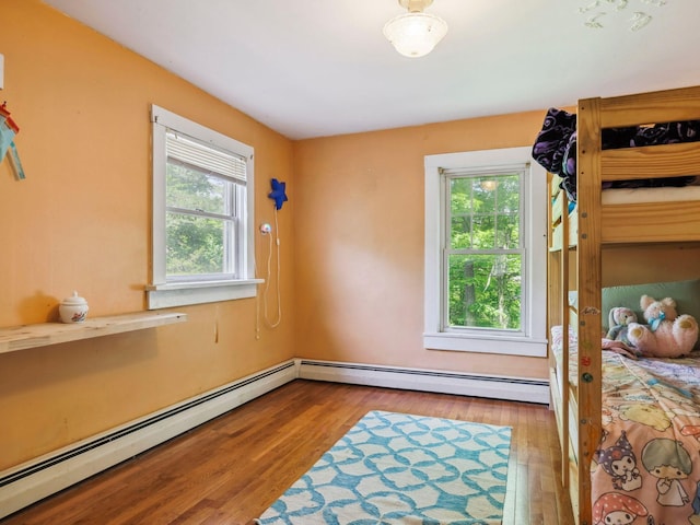 5221-5223 Rte 28, Mount Tremper, NY 12457 - unfurnished bedroom featuring wood finished floors and a baseboard heating unit