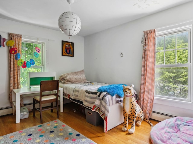 5221-5223 Rte 28, Mount Tremper, NY 12457 - bedroom featuring wood finished floors and a baseboard heating unit