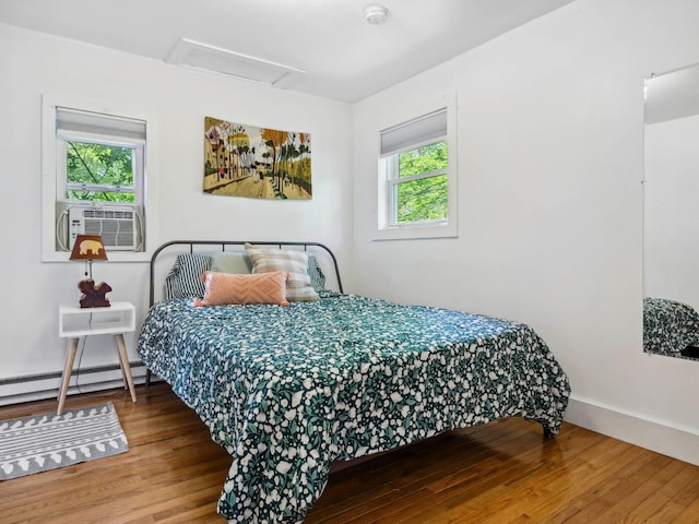 5221-5223 Rte 28, Mount Tremper, NY 12457 - bedroom with attic access, wood finished floors, baseboard heating, and baseboards