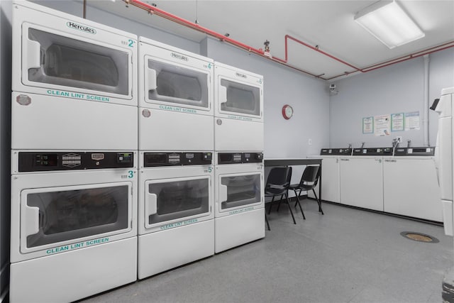 689 Fort Washington Ave Unit 4F, New York Manhattan, NY 10040 - shared laundry with estacked washer and dryer, washer and clothes dryer, and tile patterned floors