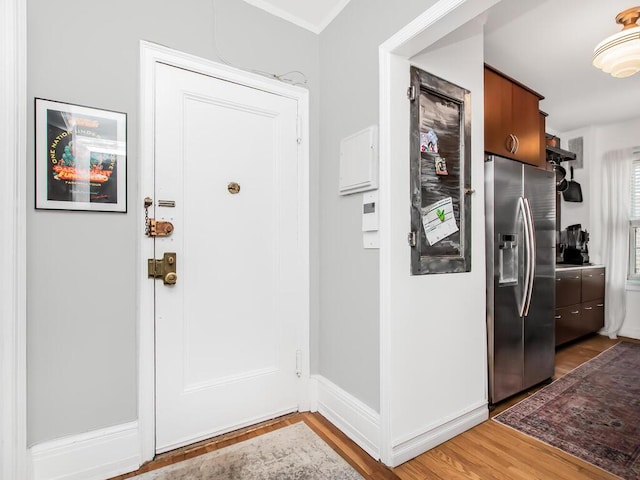 525 W 238th St Unit 1L, Bronx, NY 10463 - entrance foyer with light wood-style flooring, baseboards, and crown molding