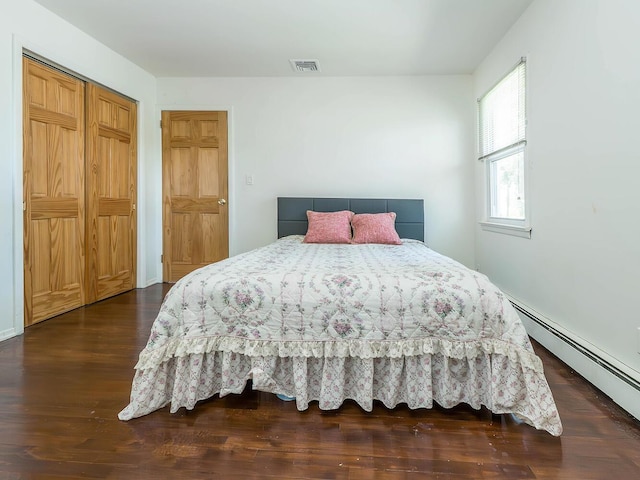 14 Marwood Rd S, Port Washington, NY 11050 - bedroom featuring wood finished floors and baseboard heating