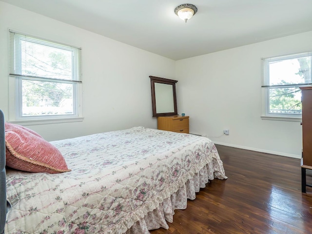 14 Marwood Rd S, Port Washington, NY 11050 - bedroom with dark wood finished floors and baseboards