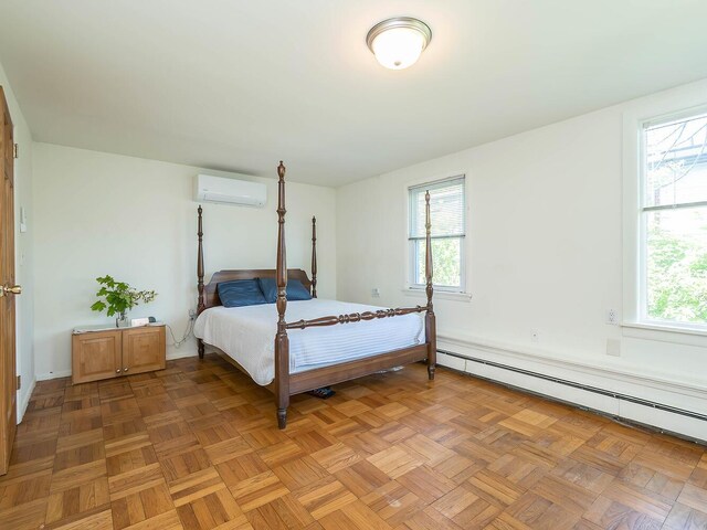 14 Marwood Rd S, Port Washington, NY 11050 - bedroom featuring a wall mounted AC, baseboard heating, and multiple windows