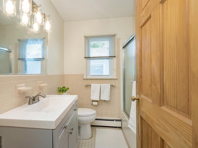 14 Marwood Rd S, Port Washington, NY 11050 - bathroom featuring a baseboard radiator, vanity, a chandelier, toilet, and tile patterned flooring