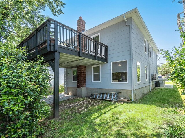 14 Marwood Rd S, Port Washington, NY 11050 - back of house featuring a yard, a wooden deck, and a chimney