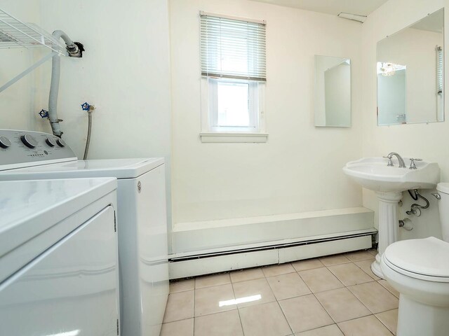 14 Marwood Rd S, Port Washington, NY 11050 - bathroom featuring a baseboard radiator, washing machine and clothes dryer, toilet, and tile patterned floors