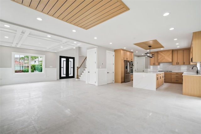 78 Shafter Ave, Albertson, NY 11507 - kitchen featuring open floor plan, a kitchen island, recessed lighting, light countertops, and a sink