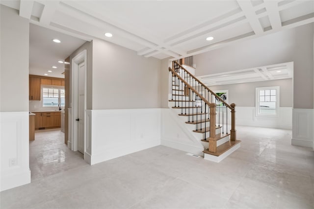78 Shafter Ave, Albertson, NY 11507 - stairs featuring coffered ceiling, a decorative wall, recessed lighting, and healthy amount of natural light