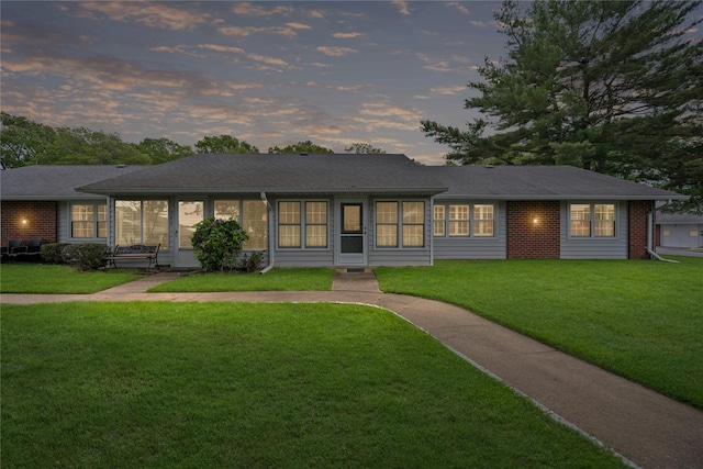 28 Trent Ct Unit B, Ridge, NY 11961 - ranch-style house featuring a front yard, a sunroom, and brick siding