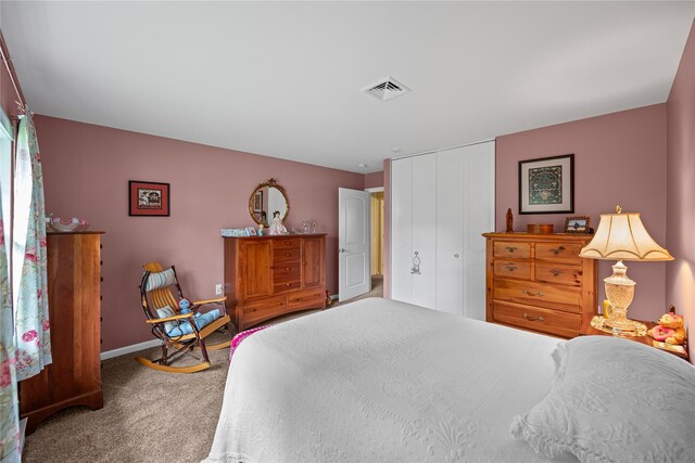 28 Trent Ct Unit B, Ridge, NY 11961 - carpeted bedroom with a closet and baseboards
