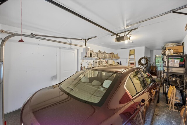 28 Trent Ct Unit B, Ridge, NY 11961 - garage with a garage door opener