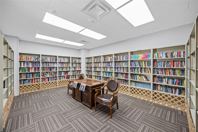 28 Trent Ct Unit B, Ridge, NY 11961 - office space featuring bookshelves, a drop ceiling, and carpet flooring