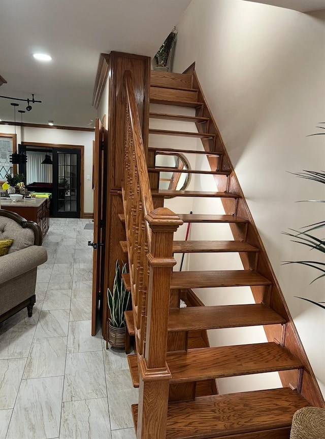 2946 Lurting Ave, Bronx, NY 10469 - staircase featuring marble look tiles and track lighting