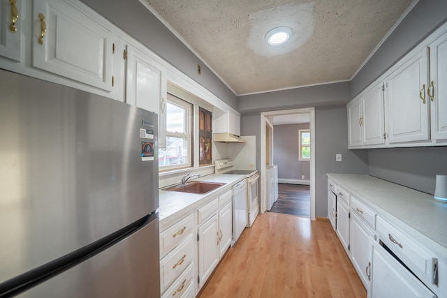 31 Peninsula Blvd, Valley Stream, NY 11581 - kitchen featuring freestanding refrigerator, white cabinetry, light countertops, white electric range, and light wood-style floors