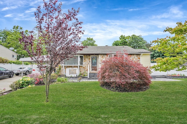263 Claywood Dr, Brentwood, NY 11717 - view of front of house featuring stone siding, a front yard, and a shingled roof