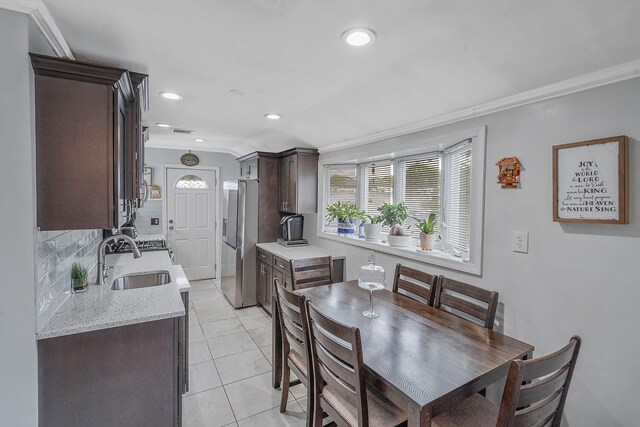 263 Claywood Dr, Brentwood, NY 11717 - dining area featuring crown molding, recessed lighting, and light tile patterned floors